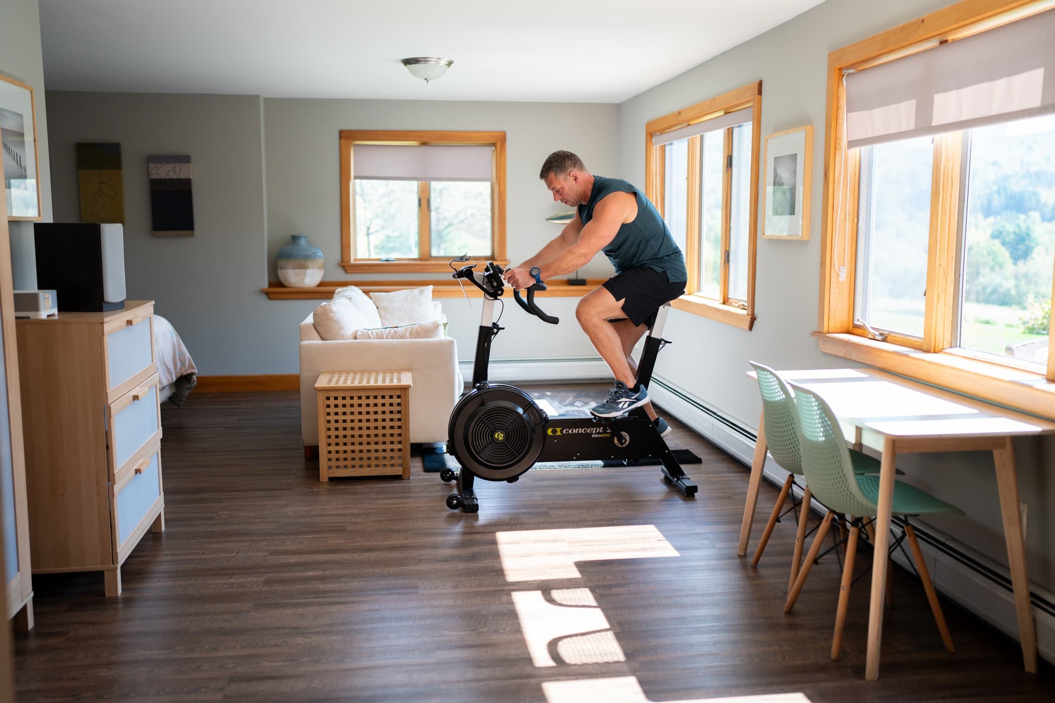 man on bikeerg in home