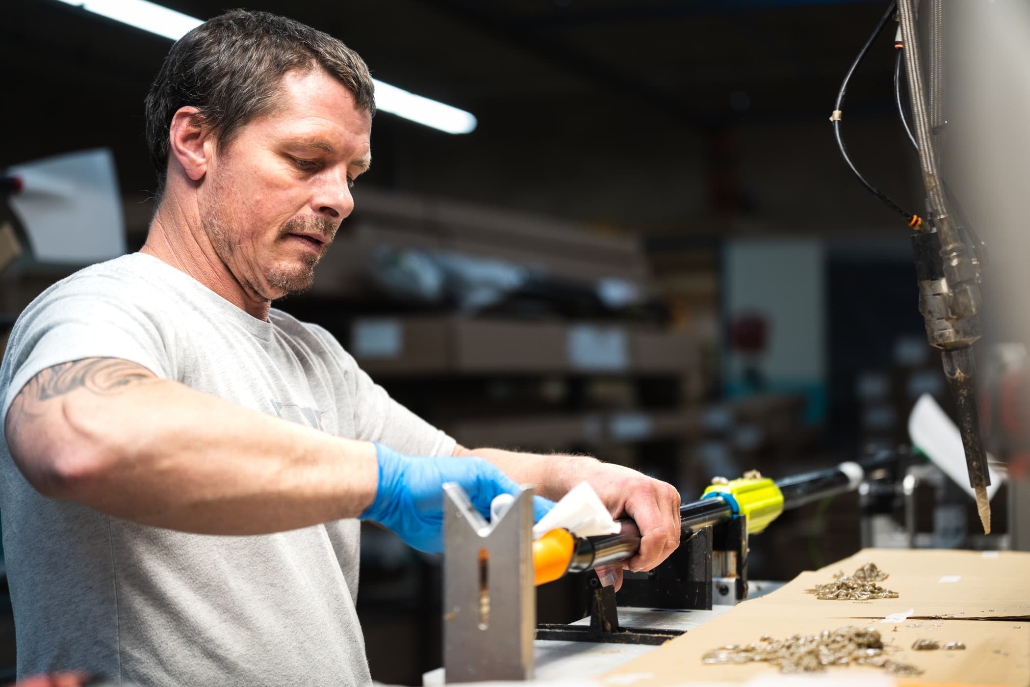 Man working on Concept2 oars