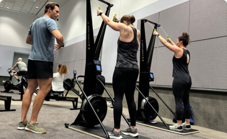 A trainer giving advice on how to use the SkiErg